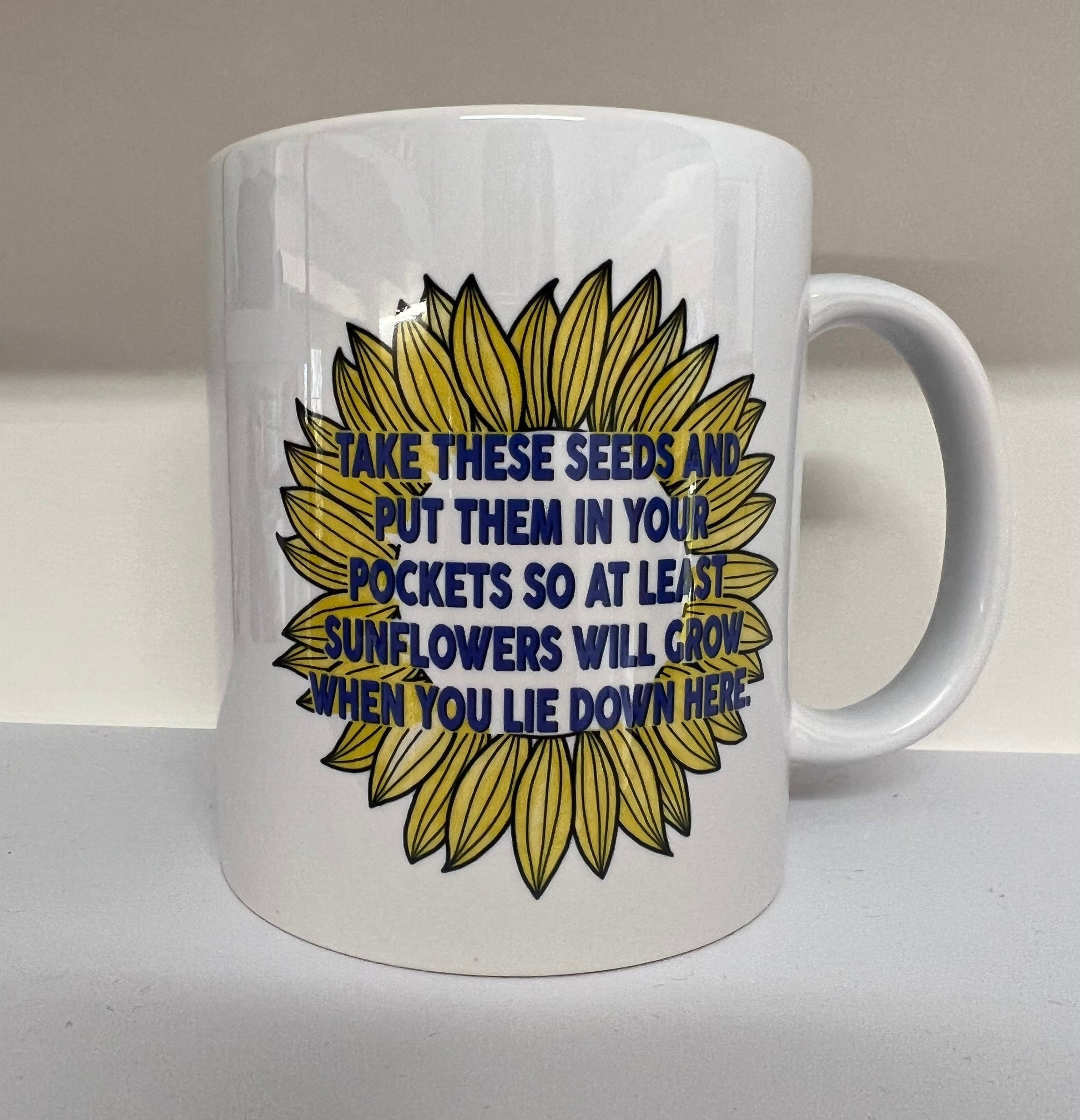 Put these Seeds in your Pocket so at least Sunflowers will grow when you lie down here Mug